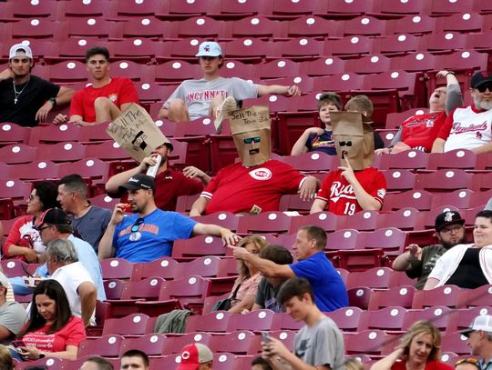 Break out the paper bags: Reds change mind about silencing fans